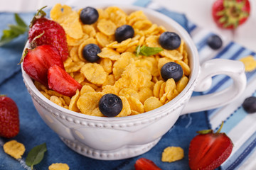 Corn flakes and fresh berries, for Breakfast. selective focus