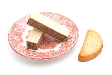 two wafers on a plate and cracker