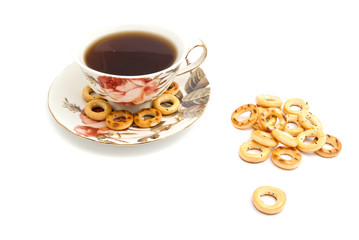 many bagels and cup of tea on white