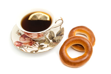 tea with Lemon and two bagels on white