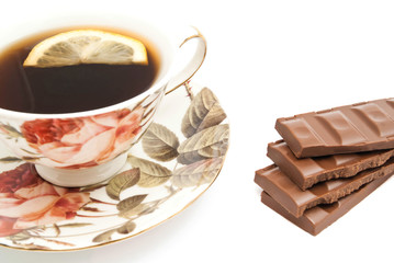 mug of tea with lemon and chocolate