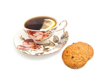 oatmeal cookies and cup of tea with lemon