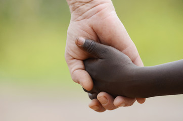 Beautiful Peace Symbol - White Woman Black Child Holding Hands. African Peace Symbol. White woman...