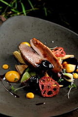Haute cuisine/Asian fusion, roasted duck with plums and shiitake mushrooms