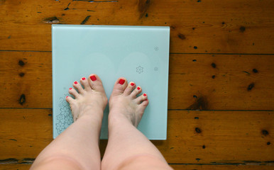 A woman weighing herself