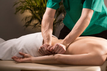 Physical therapist doing medical massage