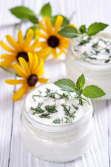 Obraz na płótnie Canvas Fresh Bulgarian yogurt with herbs on the table.