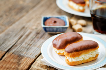 eclairs with cheese cream and chocolate glaze