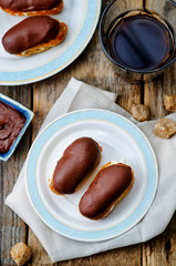 eclairs with cheese cream and chocolate glaze