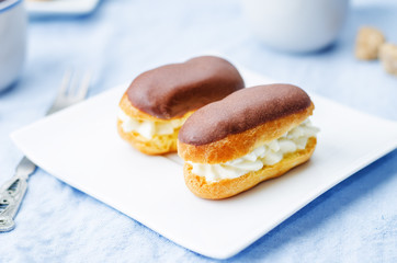 eclairs with cheese cream and chocolate glaze