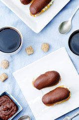 eclairs with cheese cream and chocolate glaze