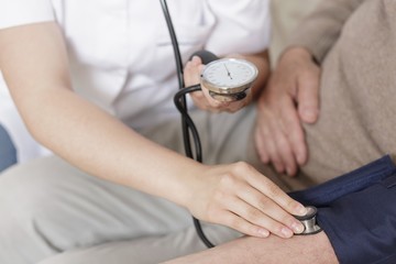 Nurse taking blood pressure
