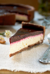 Homemade chocolate cream tart with blackberry jelly and walnuts