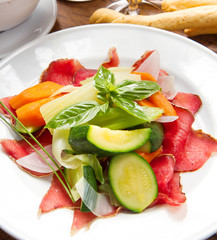 dish of bresaola and vegetables