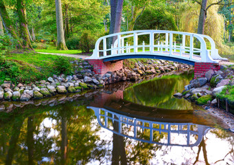 Beautiful tiny bridge over the small pond. Central park of Palanga town, Lithuania.