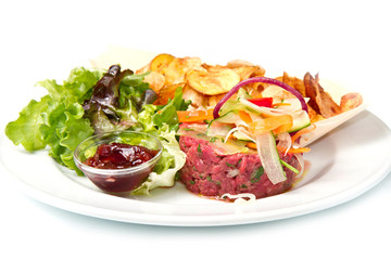 raw ground beef with chips and salad