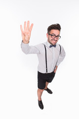 Handsome man showing four fingers in studio