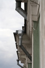 tin galvanized downspout from the roof of the building