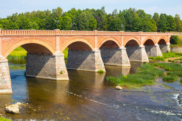 Fototapeta premium andscape with old brick bridge