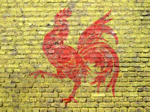 Drapeau wallon peint sur un mur