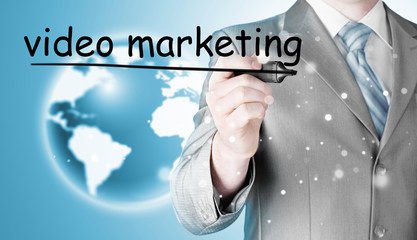 business man writing Video Marketing