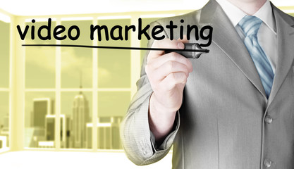 business man writing Video Marketing