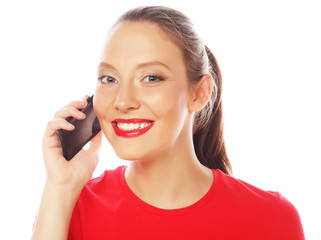 Woman using a mobile phone isolated on a white background