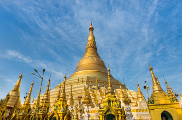 Shwedagon pagoda in Yangon, Myanmar on blue sky background  