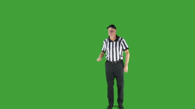 Man dressed as a football official signaling First Down.