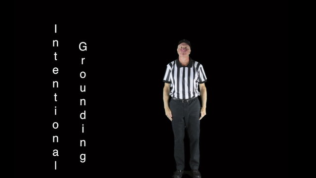 Man dressed as a football official signaling Intentional Grounding.