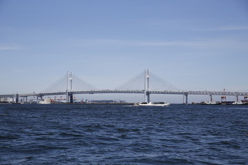 The Yokohama Bay Bridge with a water taxi in Yokohama, Japan