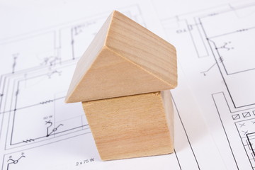 House of wooden blocks on construction drawing of house, building house concept