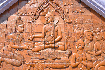 Art Thai style carving Buddha on the wall in temple,Thailand. Ge