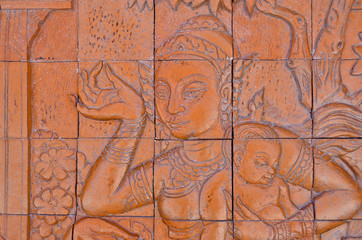 Art Thai style carving Buddha on the wall in temple,Thailand. Ge