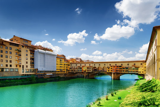 The Ponte Vecchio and old houses on waterfront of the Arno River