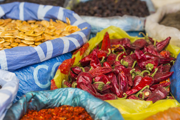 Beautiful vivid oriental market with bags full of various spices