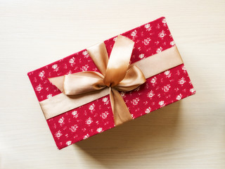 Top view on the gift box on the wooden floor