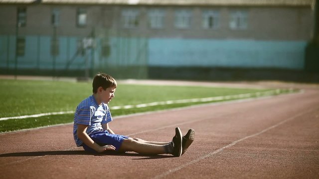 teenager boy playing sports stadium gymnastics warm-up exercises