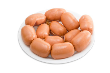 Uncooked sausages in natural casing on a plate