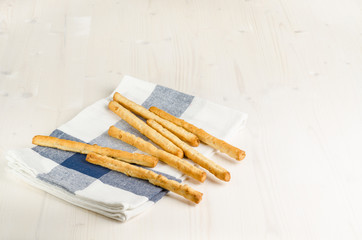 rustic breadsticks  on wood table, close up, background