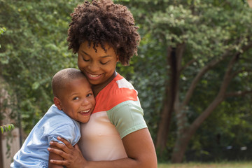 Fototapeta premium African American mother holding her son.
