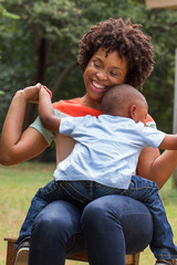 African American mother holding her son