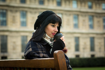 Portrait of young attractive brunette on vacation in Paris France