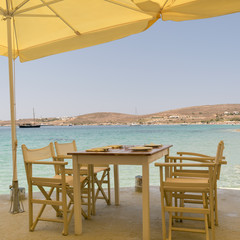 Beautiful scenic at Paros island in Greece with a greek traditional tavern against the sea.
