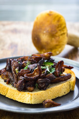 Fried wild mushrooms  on toast.