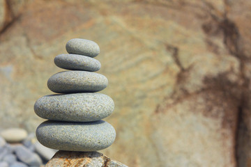 Five sea stones Balanced on the Rock. Zen stones on rock background