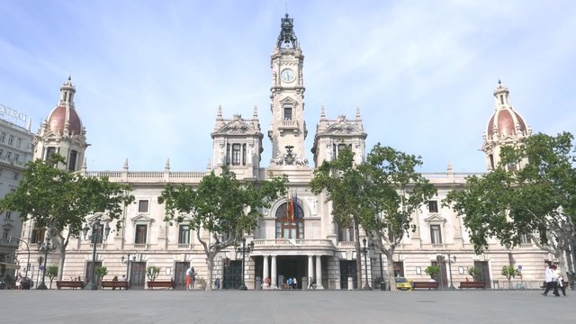 Tourist in the Ayuntamiento (City Hall) Plaza of Valencia, Spain.