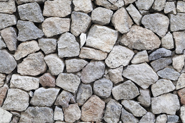 Seamless background gray granite stone wall