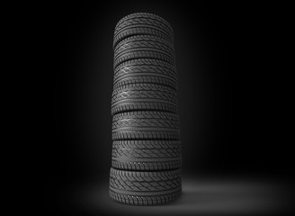 pile of tyres on black