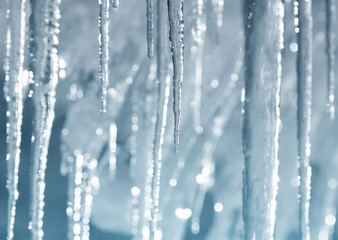 Background of bright transparent icicles in the sunlight - obrazy, fototapety, plakaty